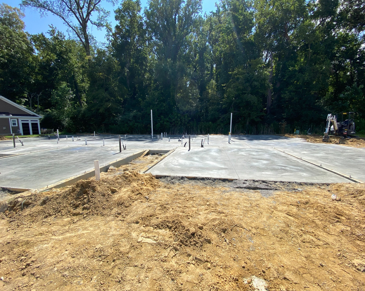 Finished residential concrete slab at a wooded property
